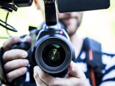 Person Holding Canon Dslr Camera Close-up Photo